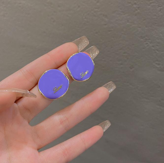 curved-purple-letter-stud-earrings